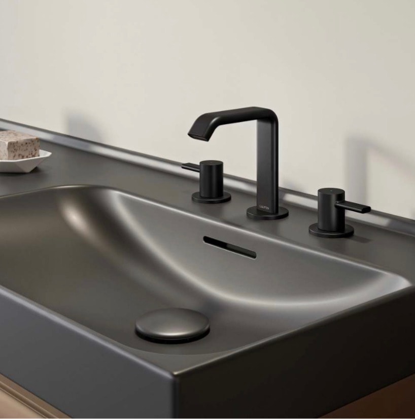 Laufen matte black faucet closeup on dark basin