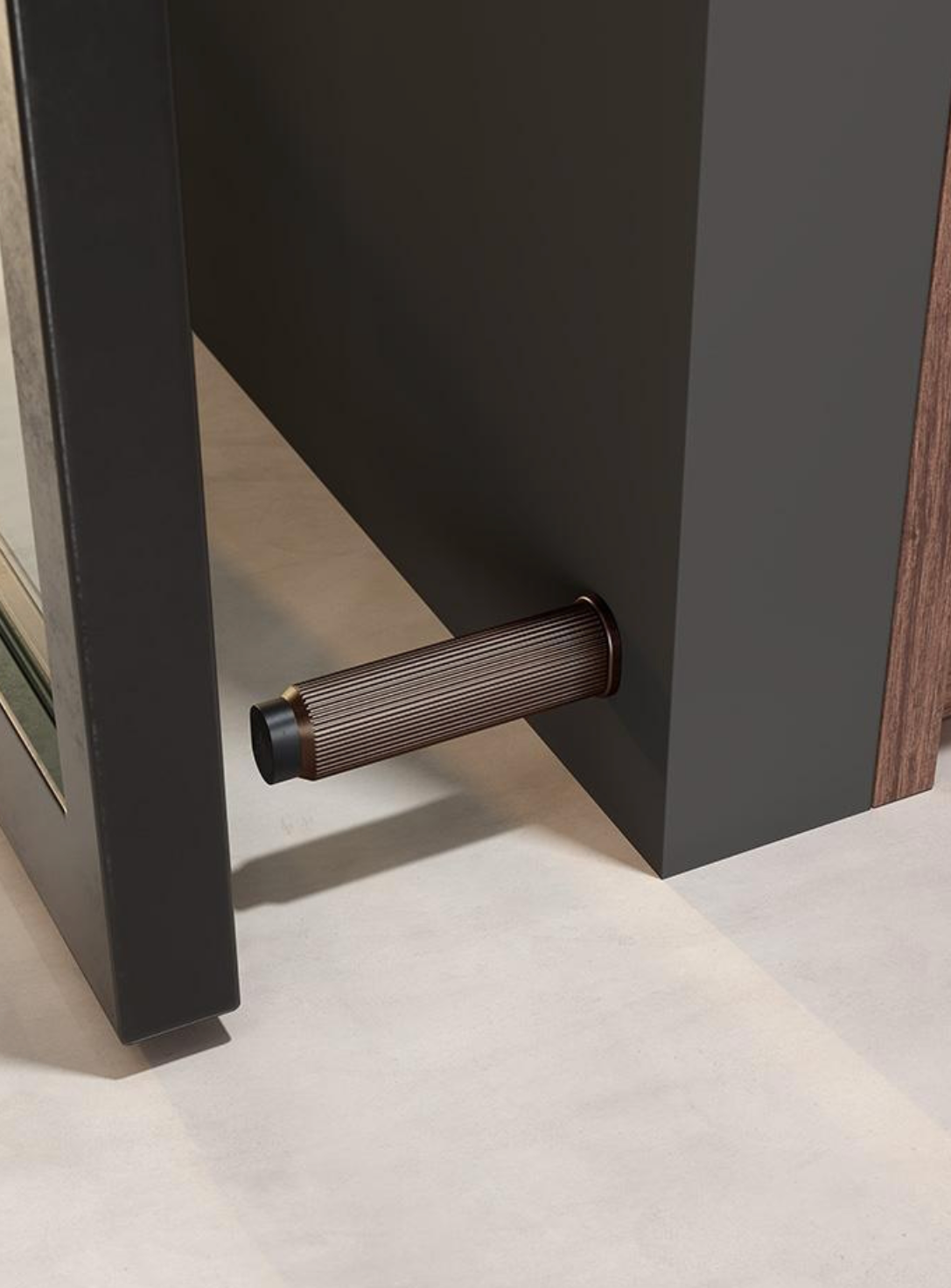 Viefe ribbed bronze cabinet pull on dark panel